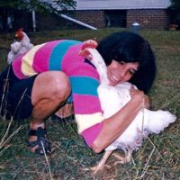 Karen Davis hugging Alice the chicken