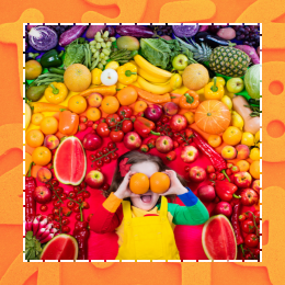 child with fruits and vegetables