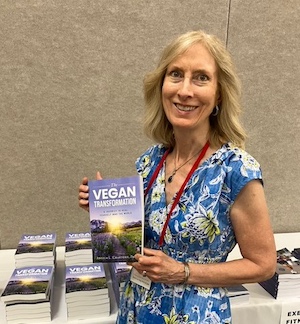 Angela Crawford holding her book