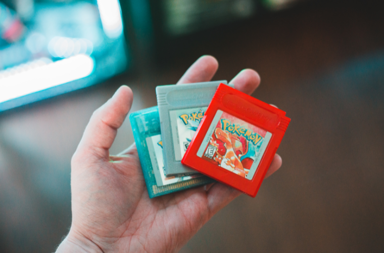hand holding Pok�mon game cartridges