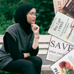human sitting on bench and coupons
