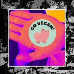 image of hand and vegan sticker